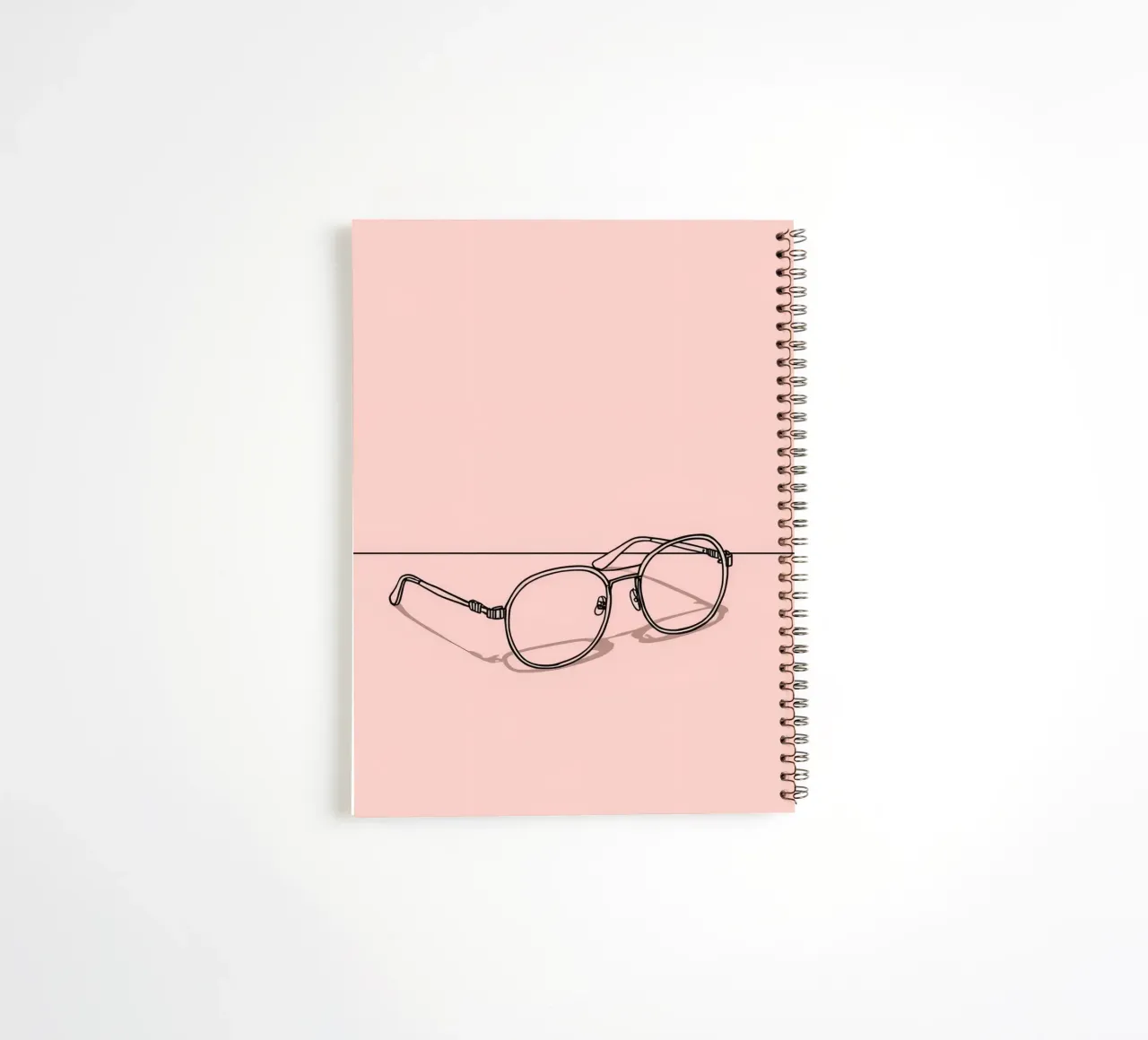 Stylish eyewear captured on a minimalistic pink background spiral notebook by DesignDoodle