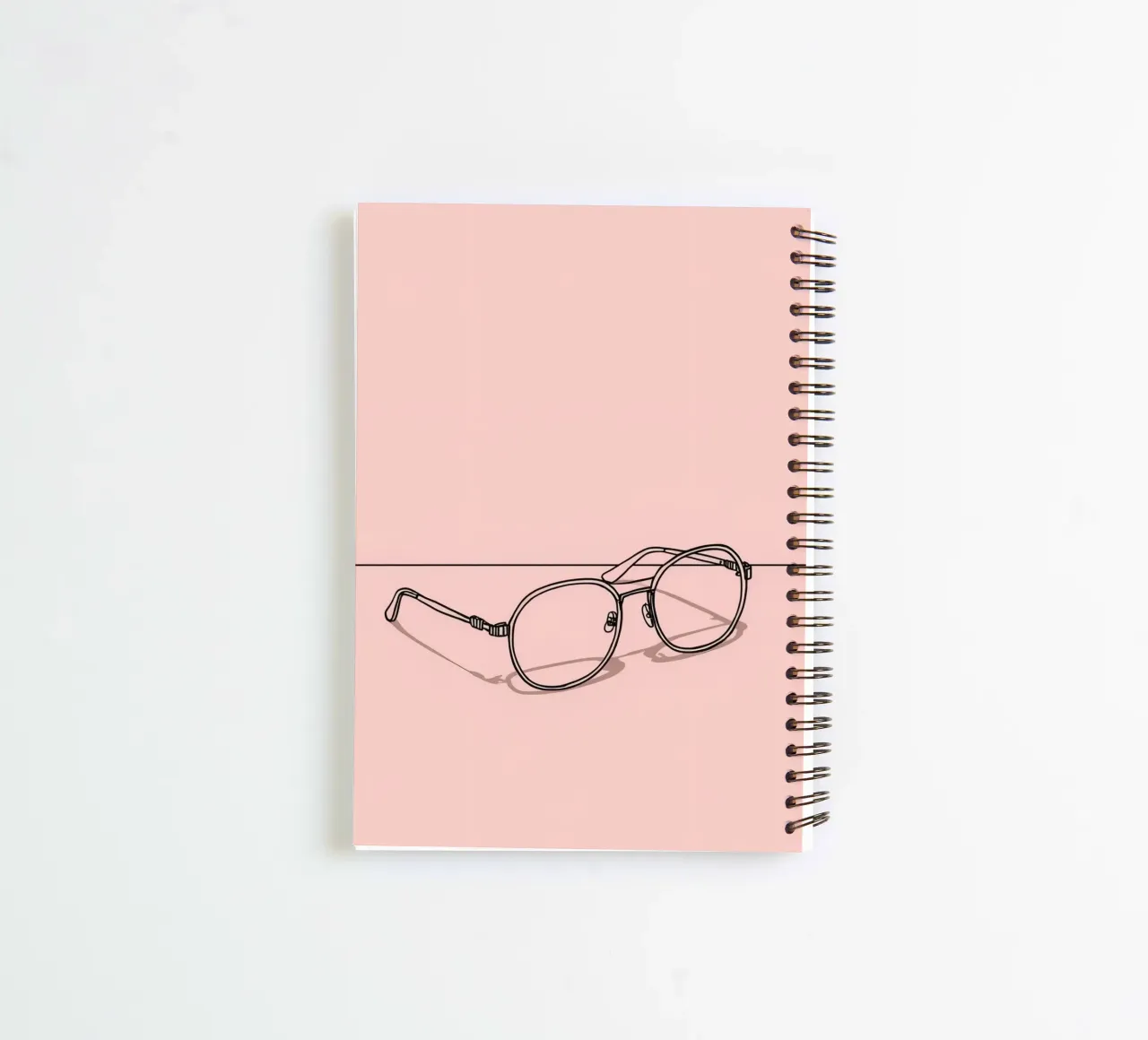 Stylish eyewear captured on a minimalistic pink background spiral notebook by DesignDoodle