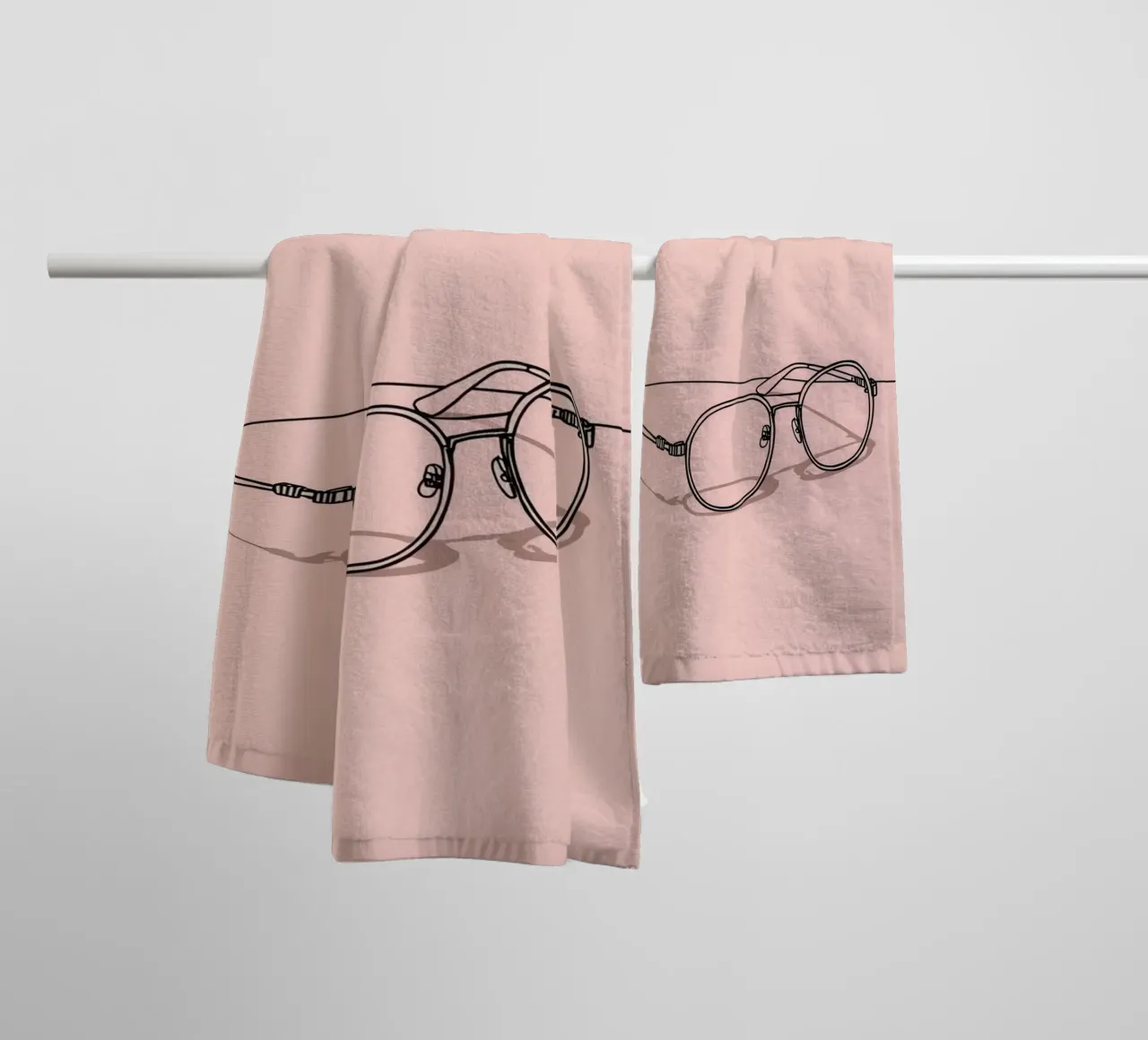 Stylish eyewear captured on a minimalistic pink background towel by DesignDoodle