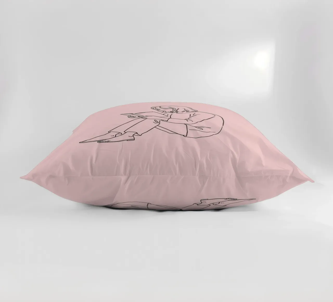 Woman reading a book quietly decorative cushion by DesignDoodle