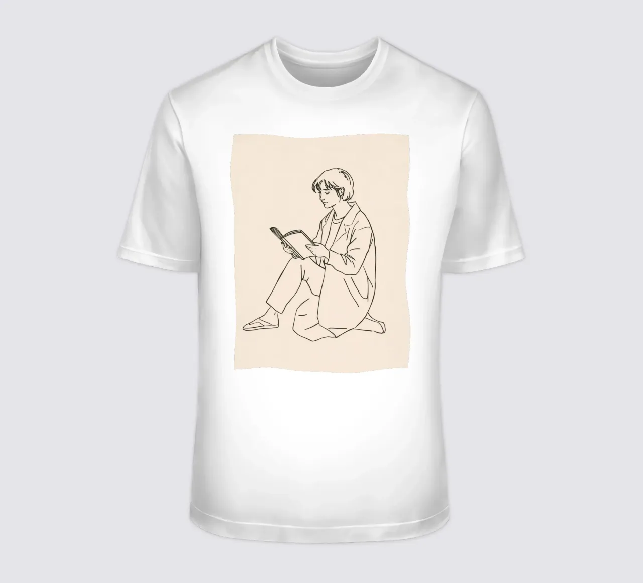 Person reading a book while sitting on the floor in a casual t-shirt by DesignDoodle