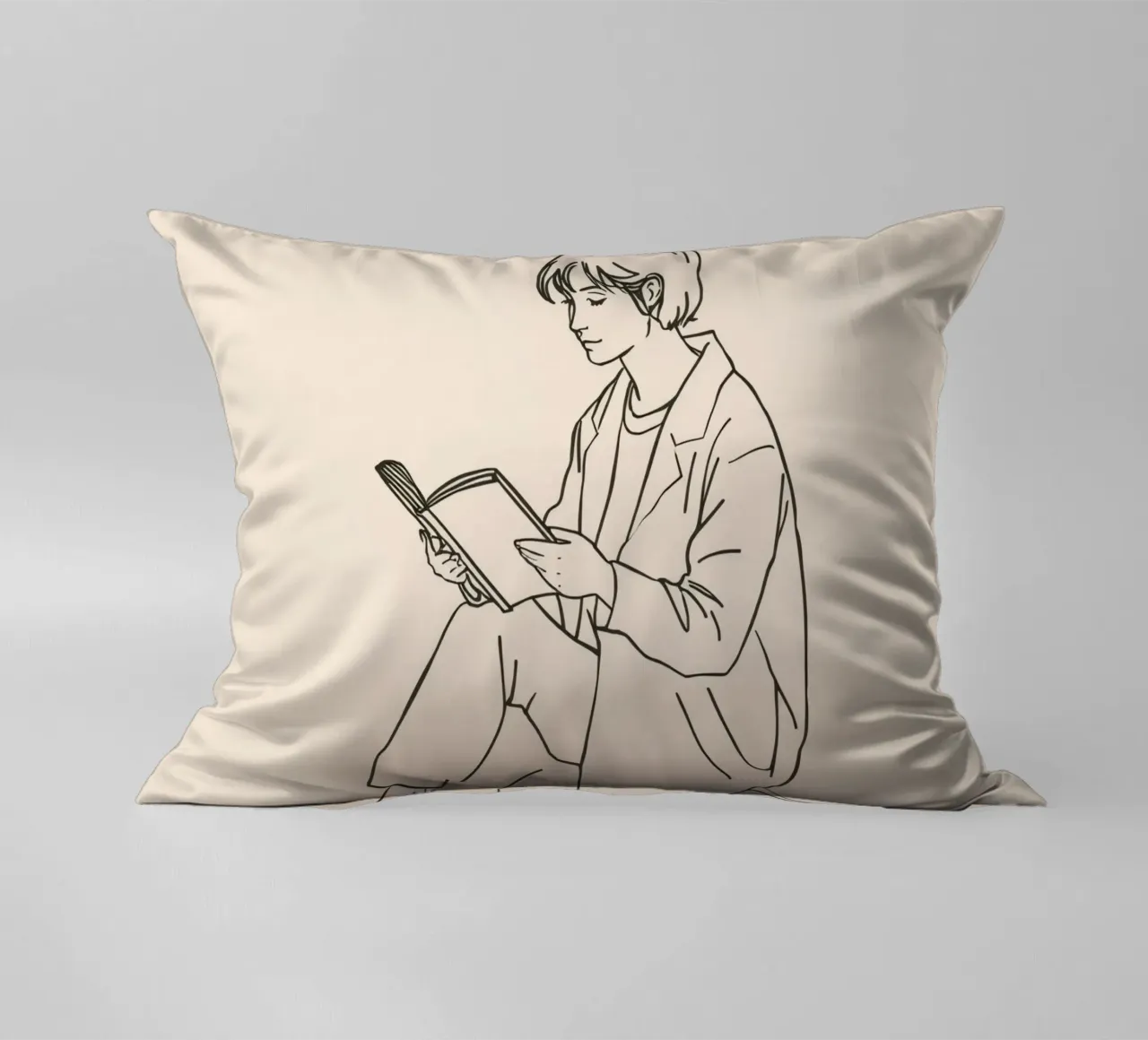 Person reading a book while sitting on the floor in a casual decorative cushion by DesignDoodle