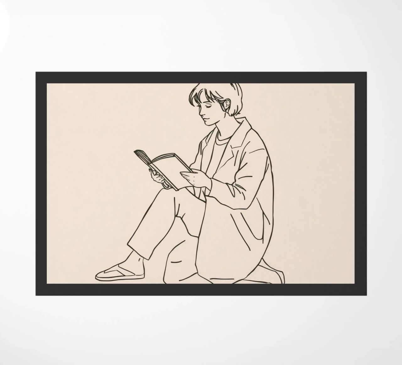 Persona che legge un libro seduta a terra in un ambiente informale zerbino da DesignDoodle