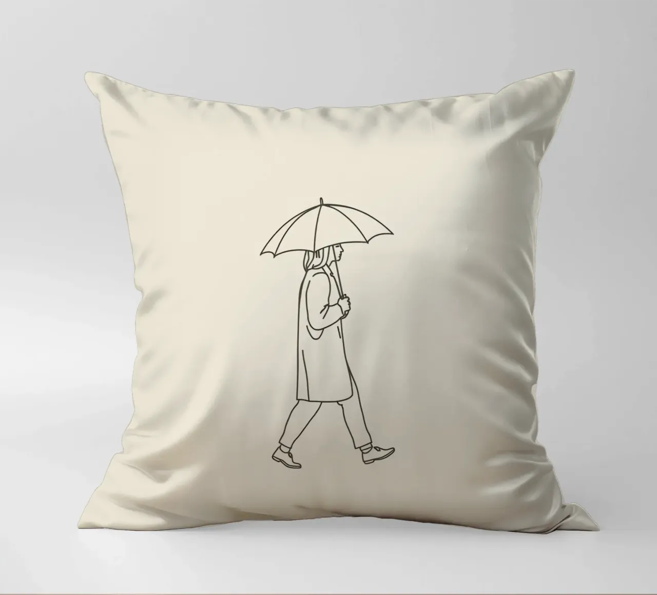 Person walking with umbrella in light rain on a neutral art decorative cushion by DesignDoodle