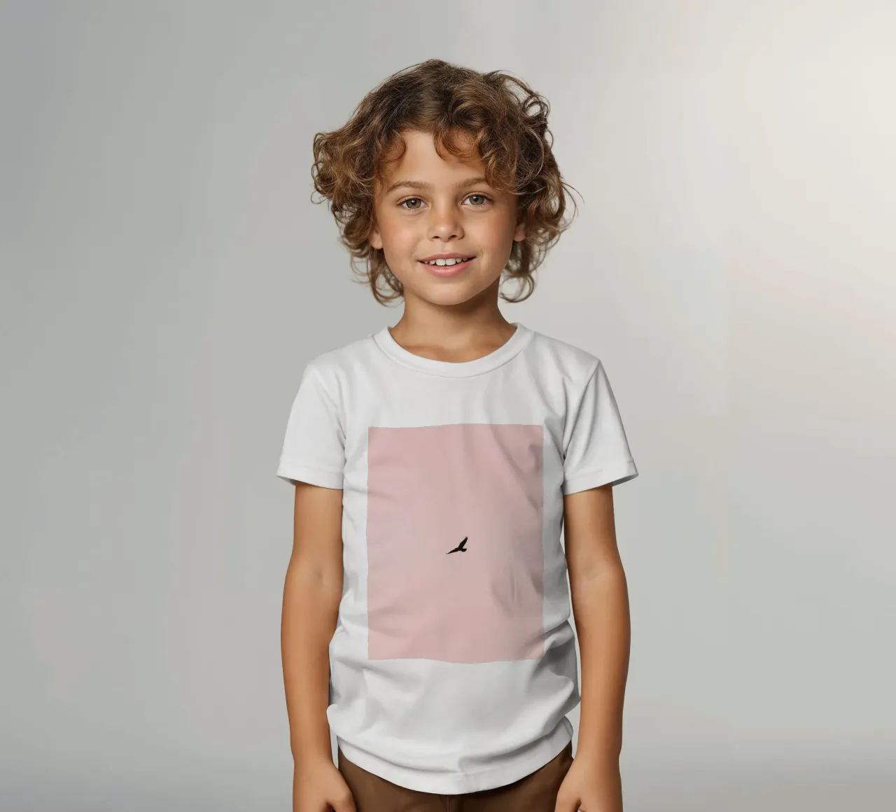 Eagle soaring through a pastel sky at dusk over a quiet land kids t-shirt by DesignDoodle