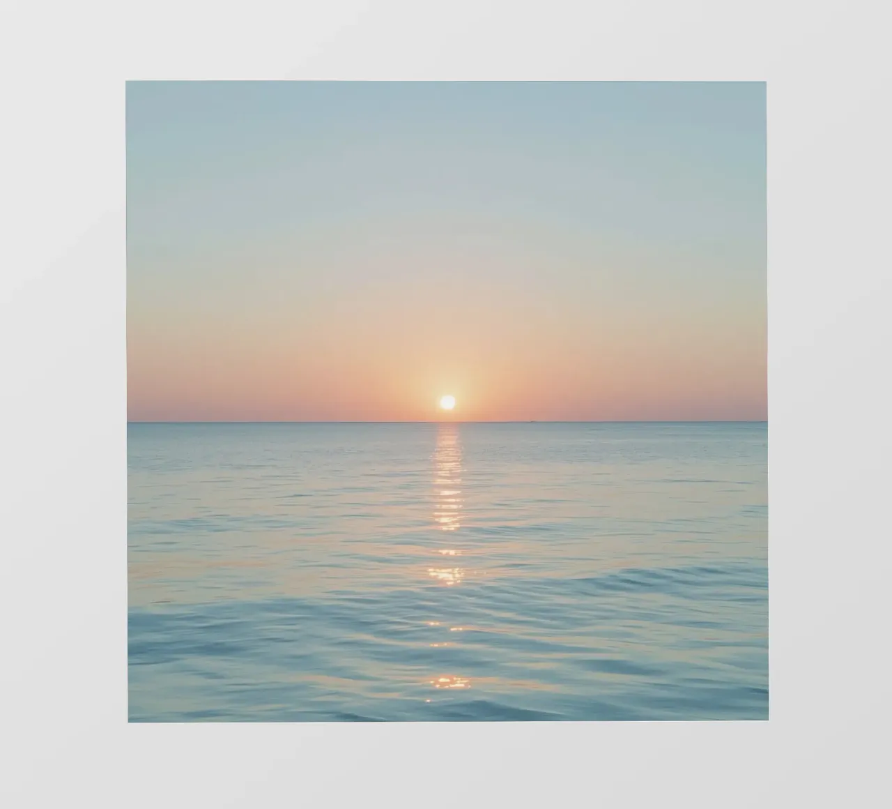 Sunset over calm ocean waters with pastel hues reflecting photo wallpaper by DesignDoodle