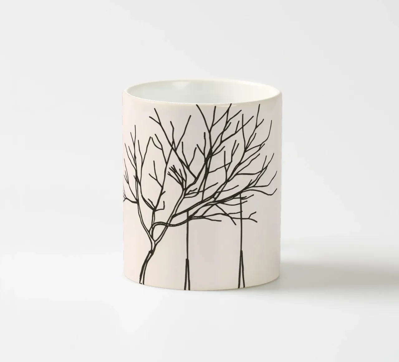 Swing hanging from a bare tree in a quiet landscape ceramic mug by DesignDoodle