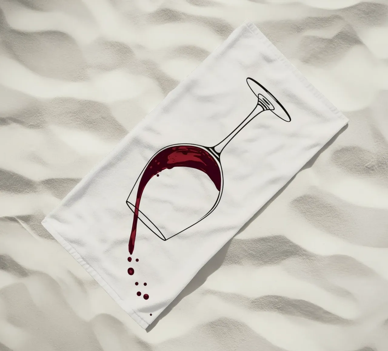 Red wine being poured into a glass with splashes captured beach towel by DesignDoodle