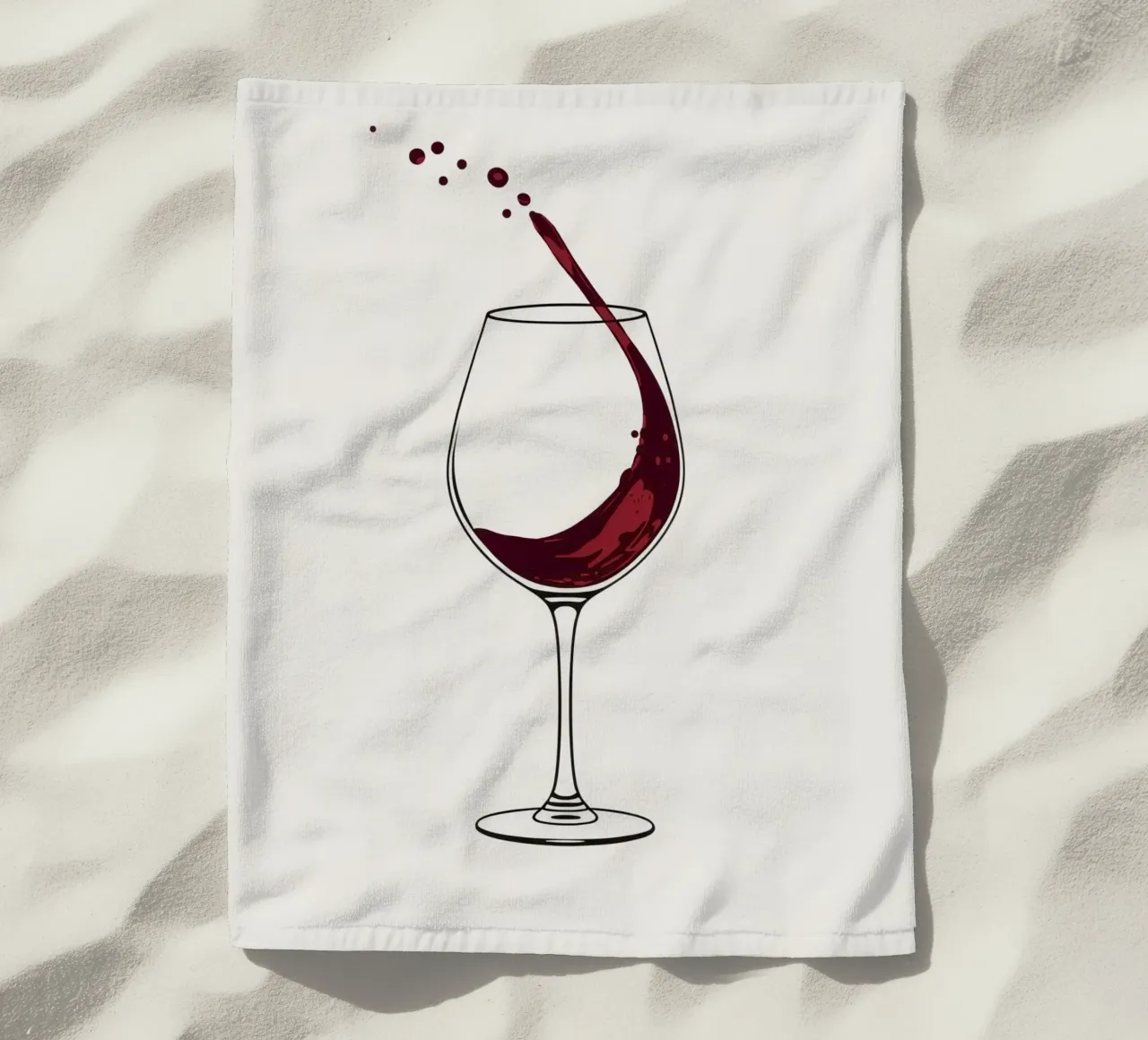 Red wine being poured into a glass with splashes captured beach towel by DesignDoodle