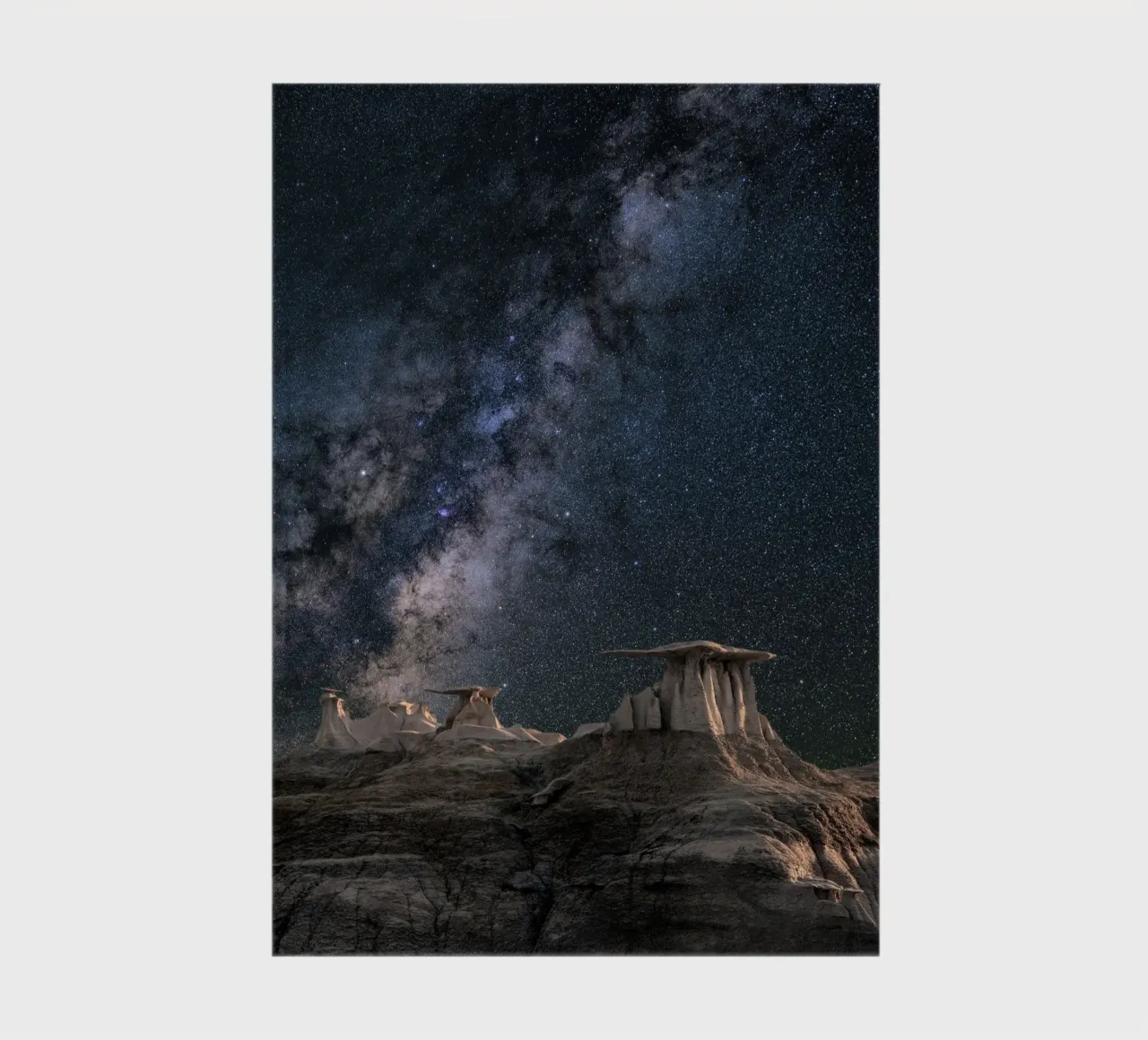 rock formations behind starry sky notebook by space words
