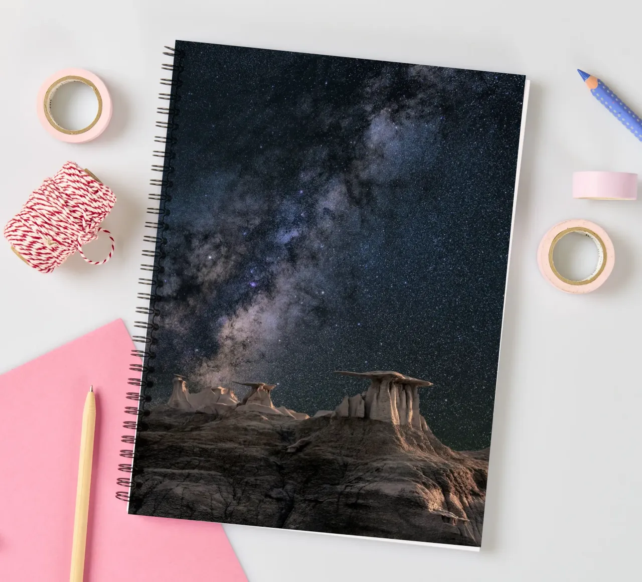 rock formations behind starry sky spiral notebook by space words