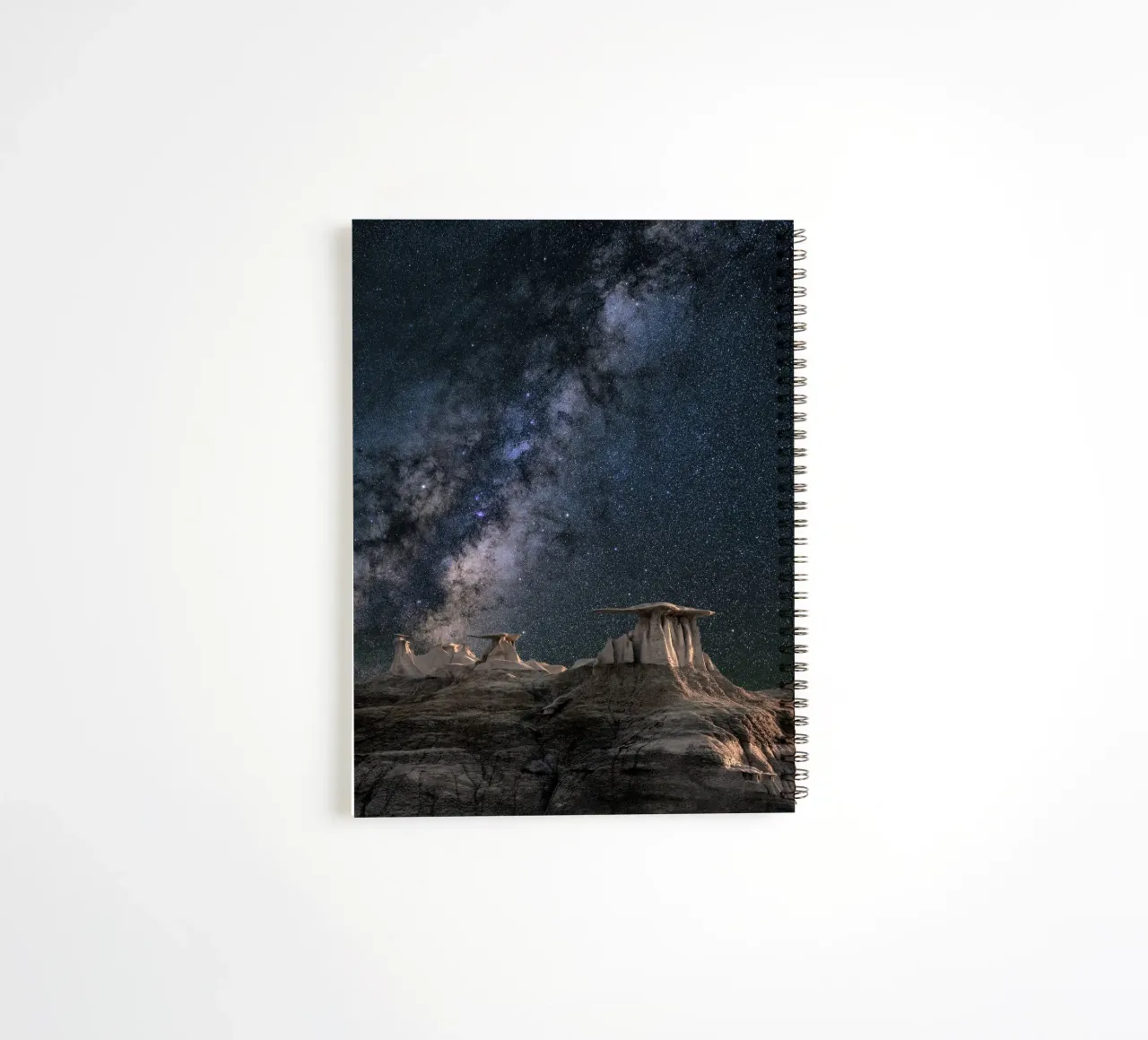 rock formations behind starry sky spiral notebook by space words