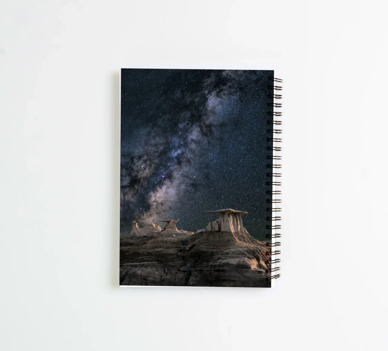 rock formations behind starry sky spiral notebook by space words