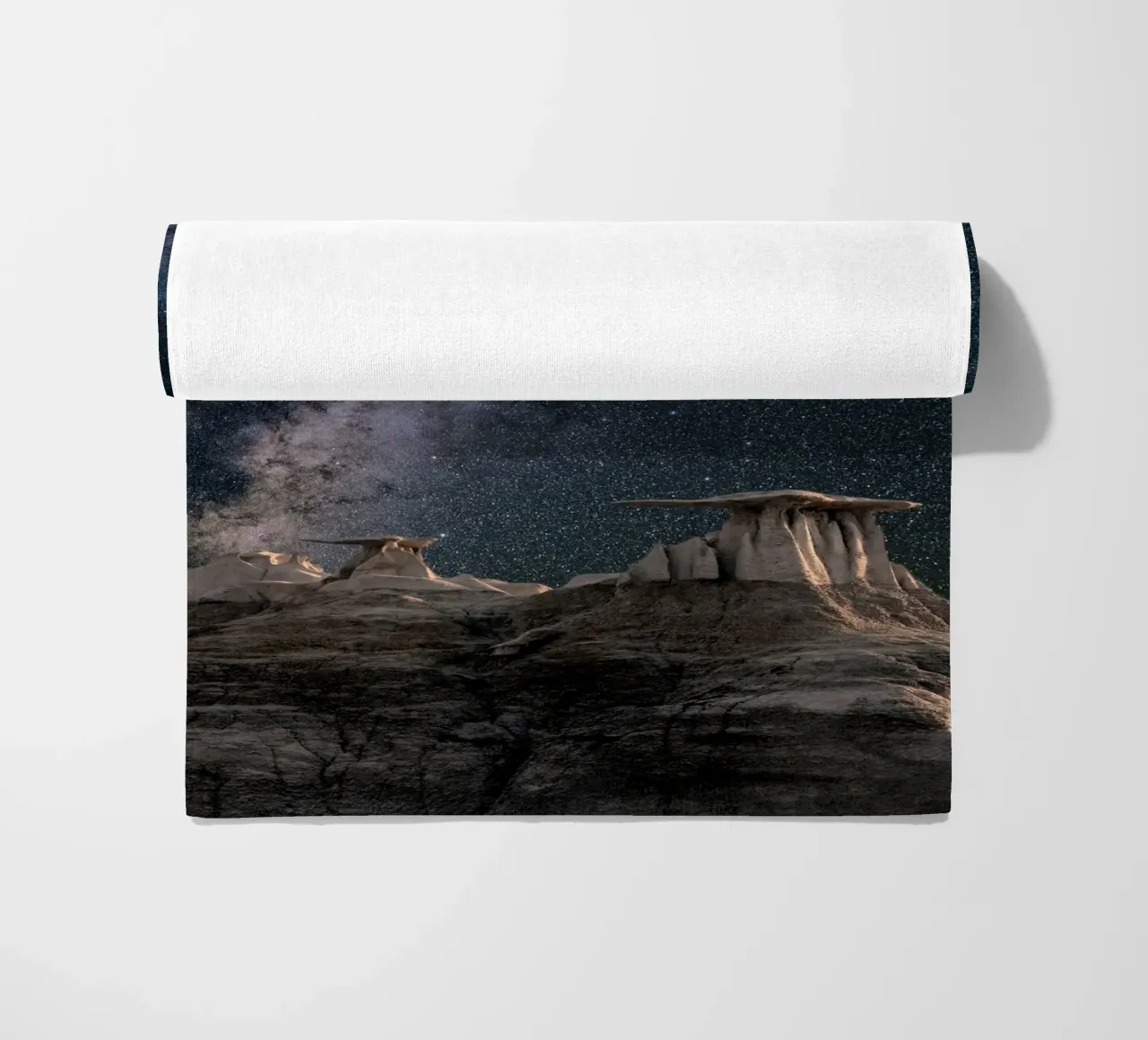 rock formations behind starry sky beach towel by space words