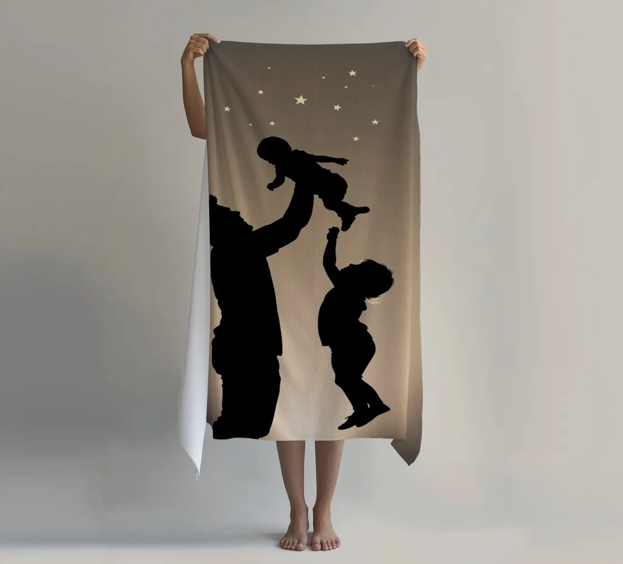 Father hold child while sibling reaches up towards the stars beach towel by DesignDoodle