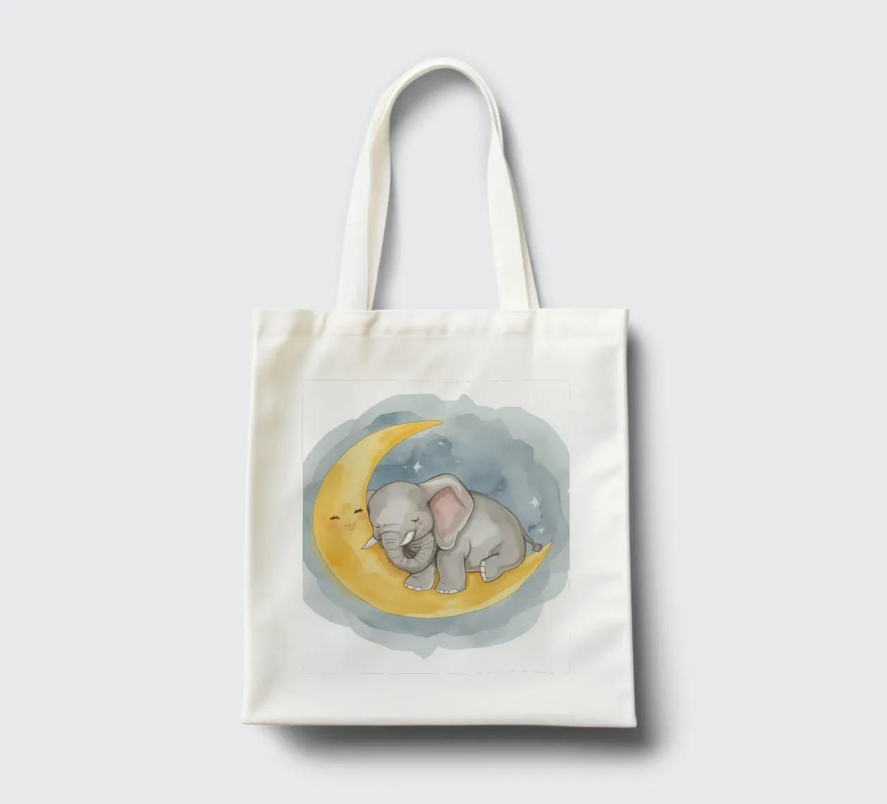 Un petit éléphant se repose sur la lune jaune avec un visage endormi. tote bag de DesignDoodle