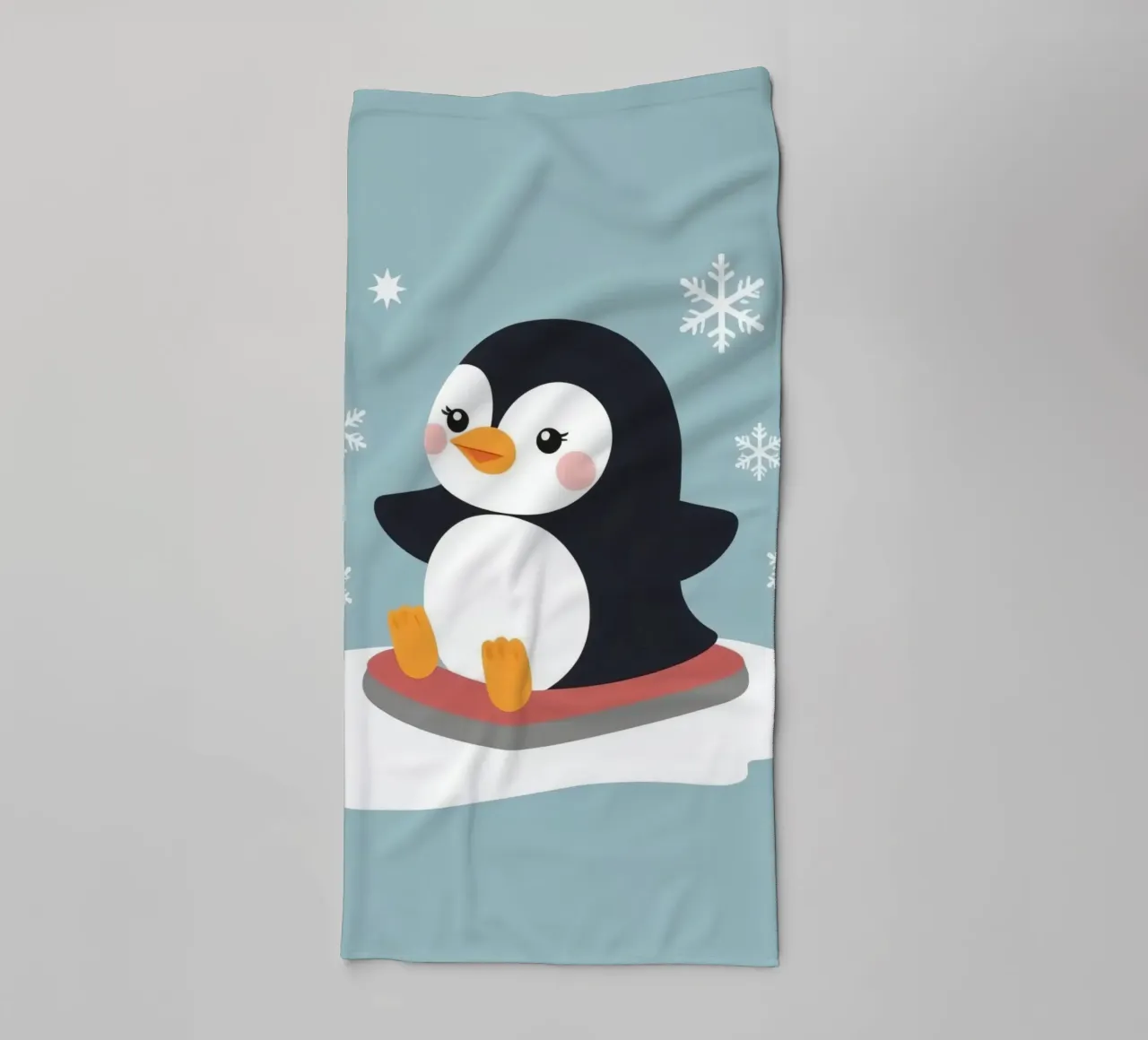 Cute cartoon penguin on a sled with falling snowflakes towel by DesignDoodle