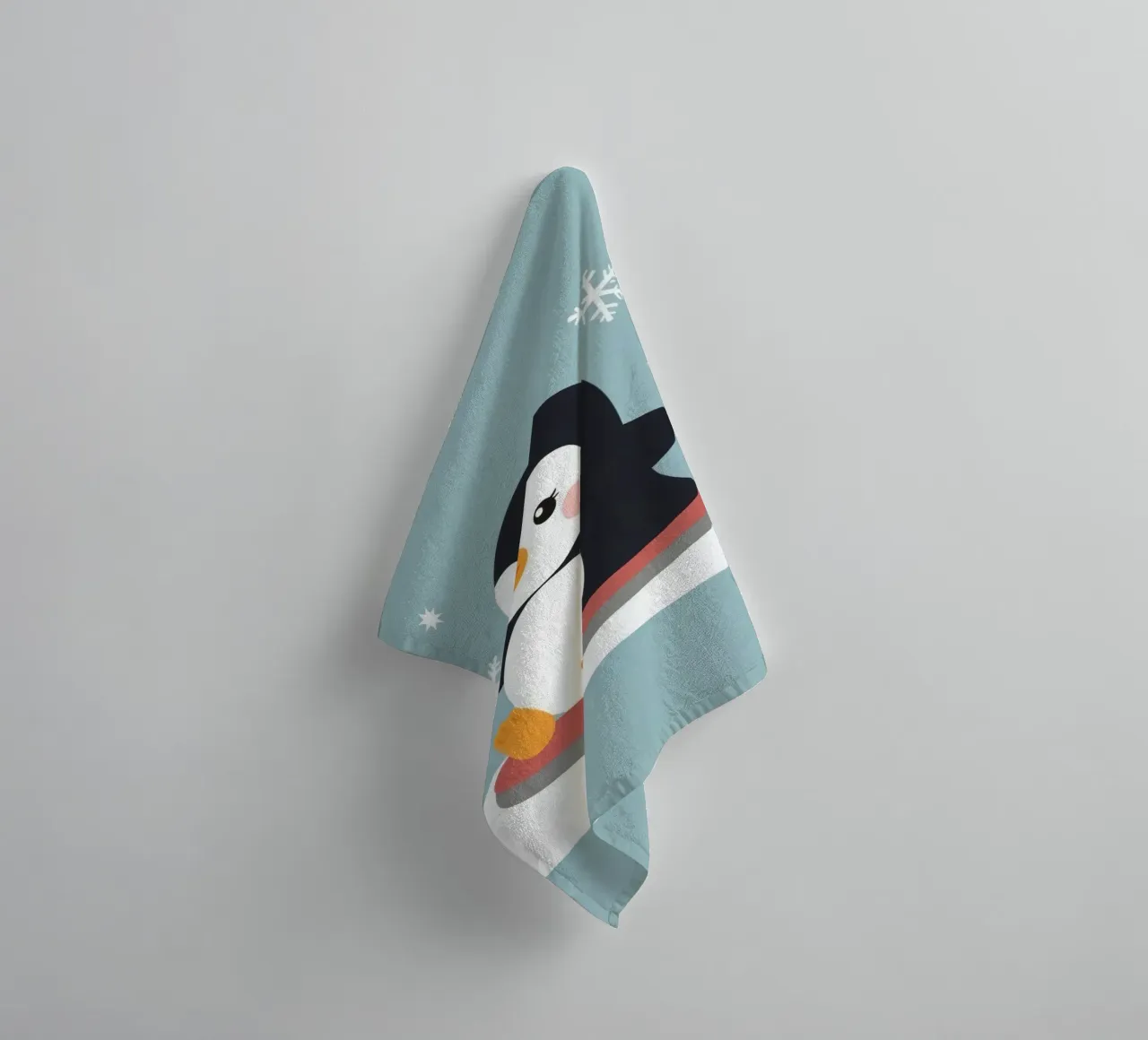 Cute cartoon penguin on a sled with falling snowflakes towel by DesignDoodle