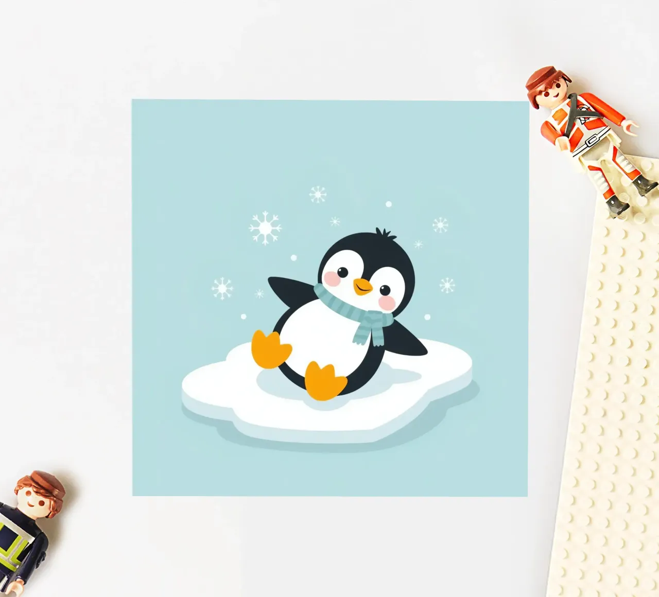 Un mignon pingouin avec une écharpe bleu clair se repose sur une glace blanche. autocollant de DesignDoodle