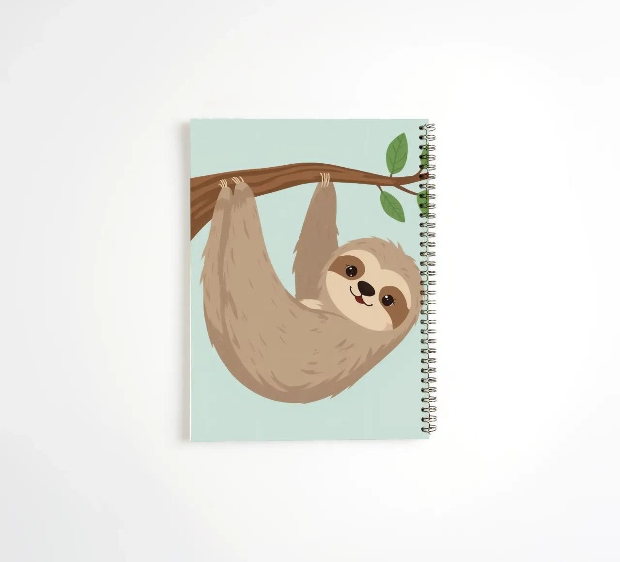 Cute cartoon sloth hangs upside down from a brown branch spiral notebook by DesignDoodle