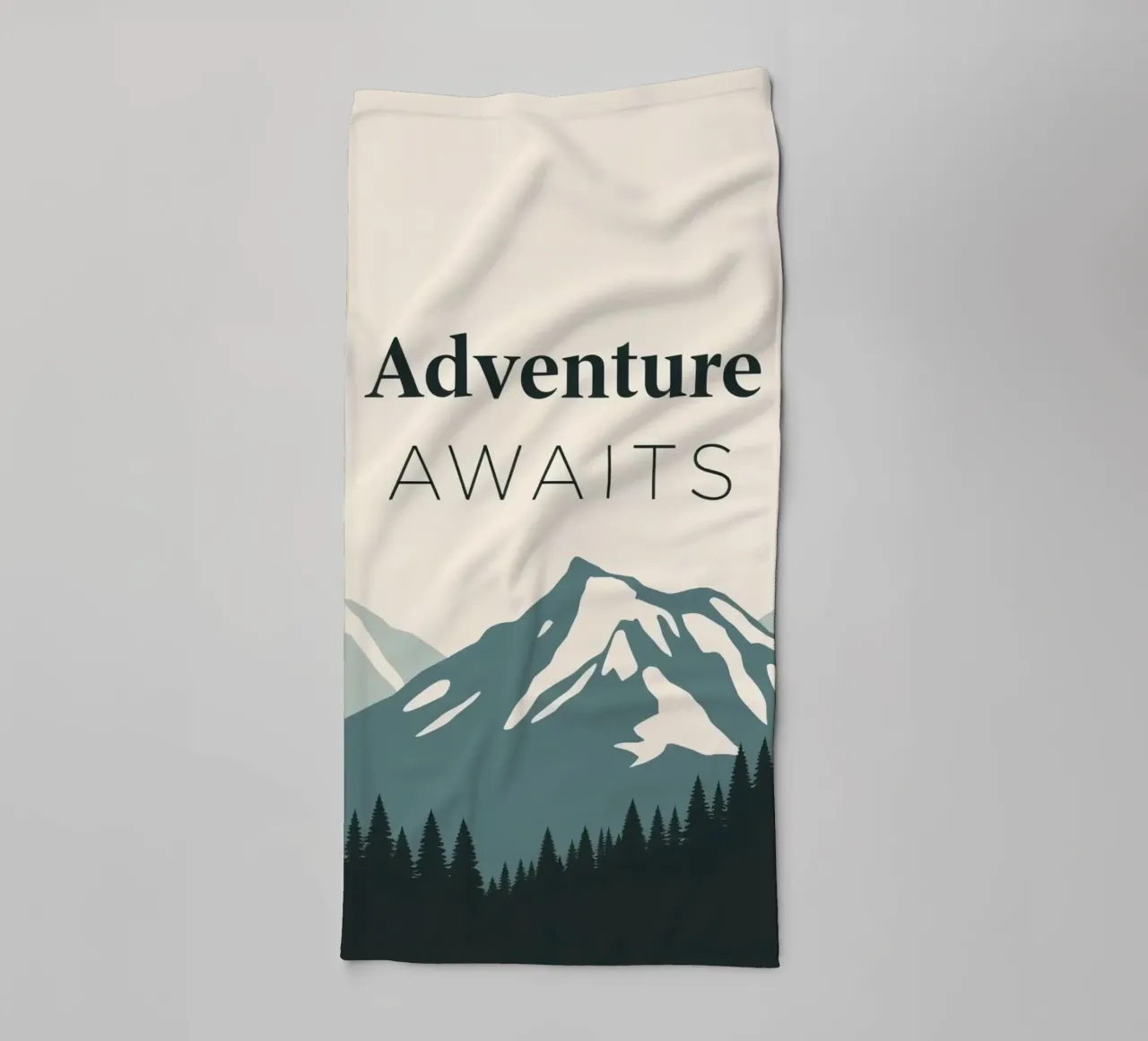 Mountains and trees art with text 'Adventure Awaits' towel by DesignDoodle