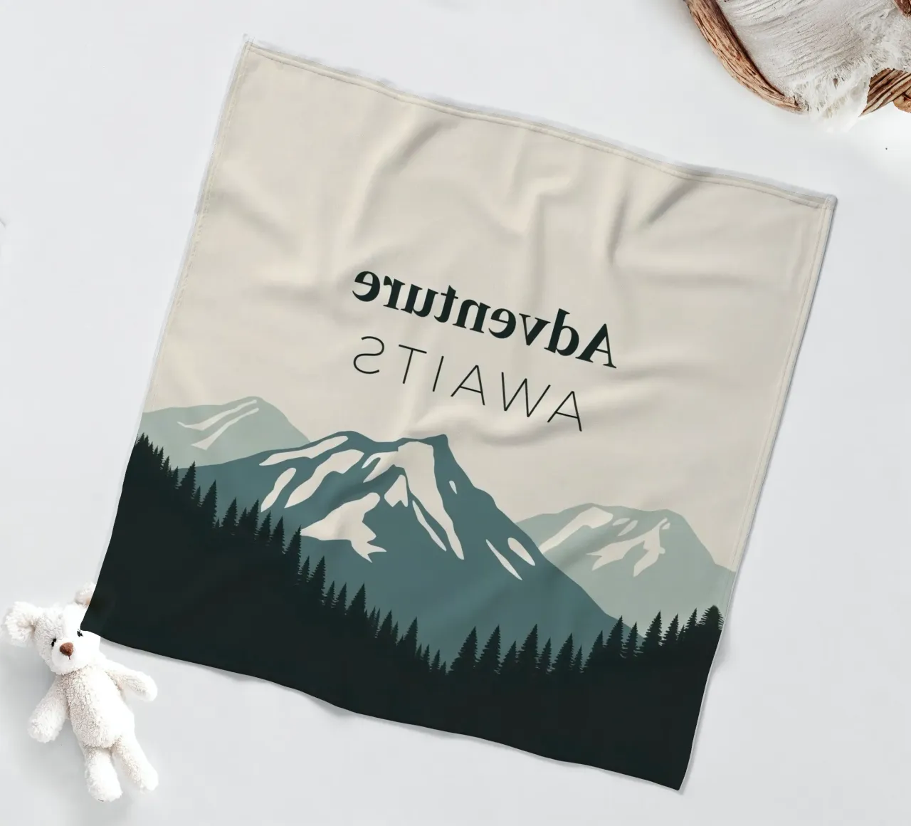 Mountains and trees art with text 'Adventure Awaits' fleece blanket by DesignDoodle