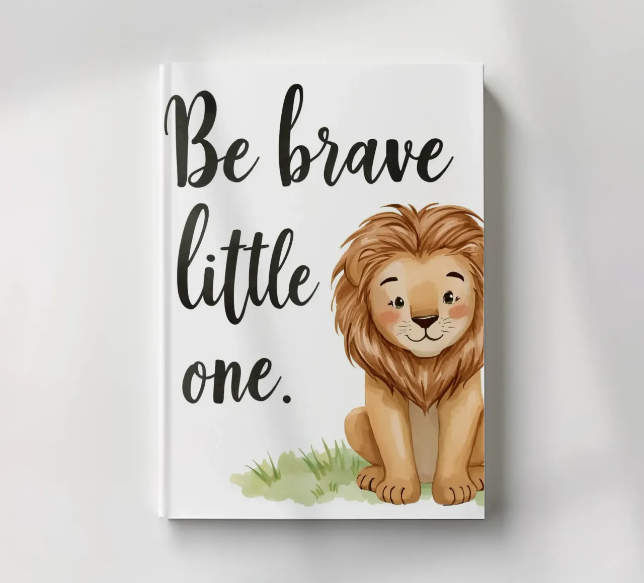 Be brave little one art with a cartoon lion sitting on grass notebook by DesignDoodle