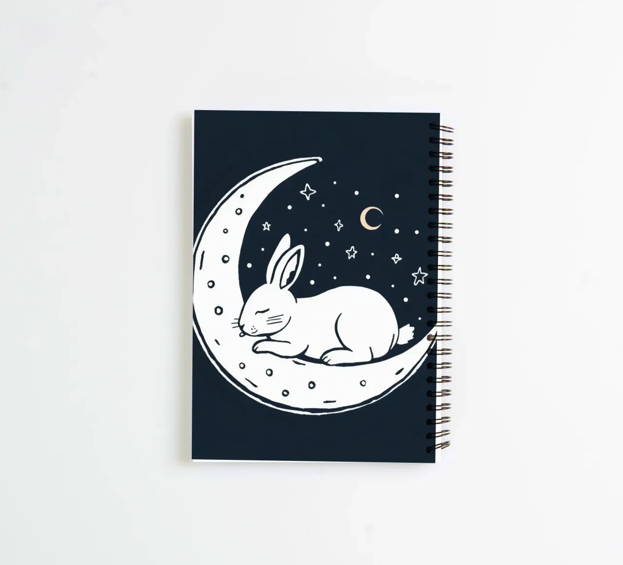 Sleeping bunny resting on crescent moon surrounded by stars spiral notebook by DesignDoodle