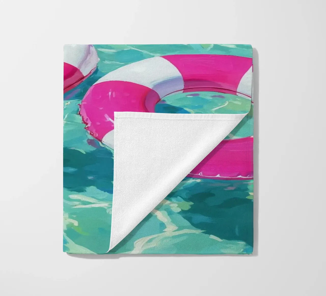 Cheerful floating tyres beach towel by Carinaprint