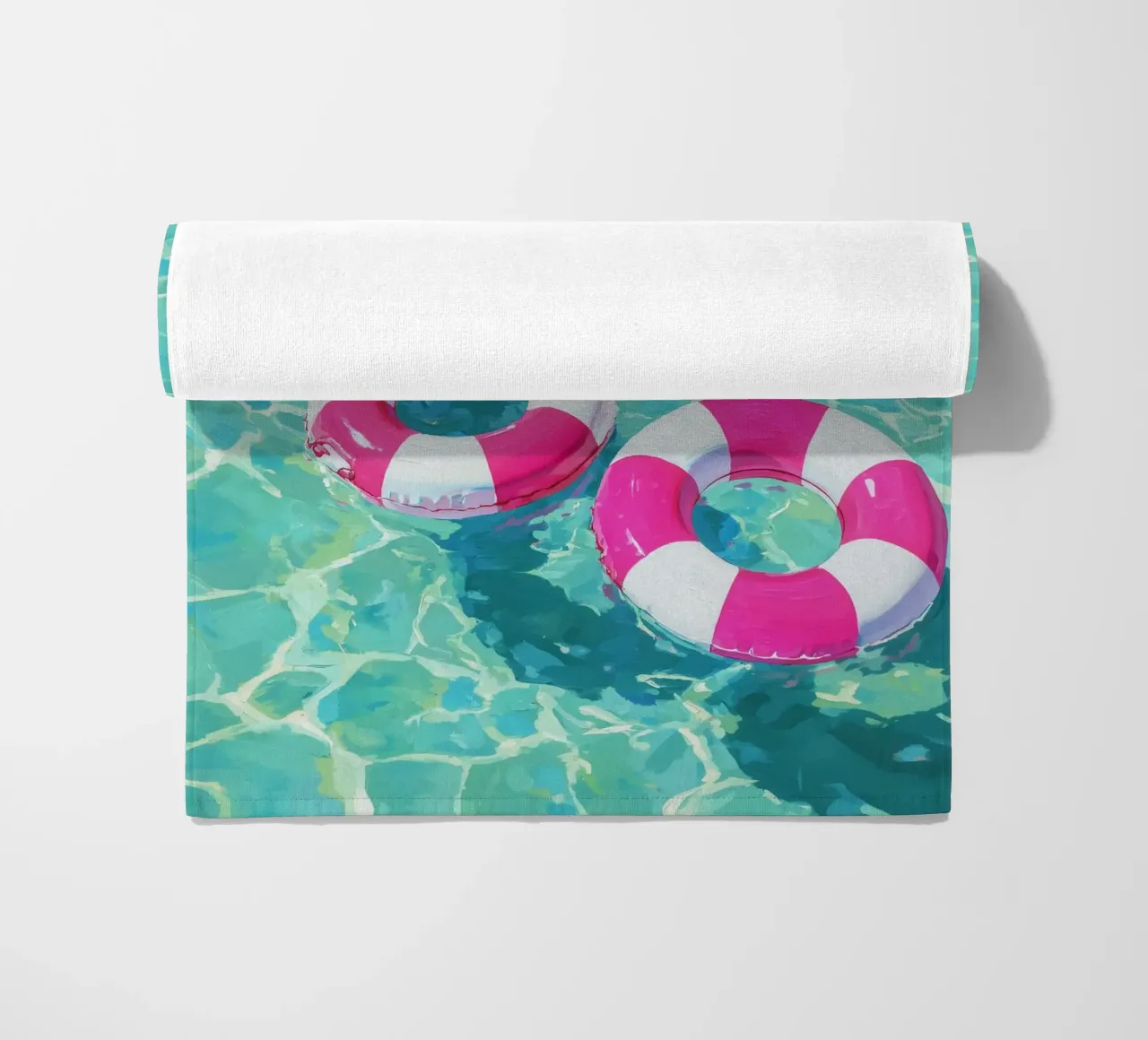 Cheerful floating tyres beach towel by Carinaprint