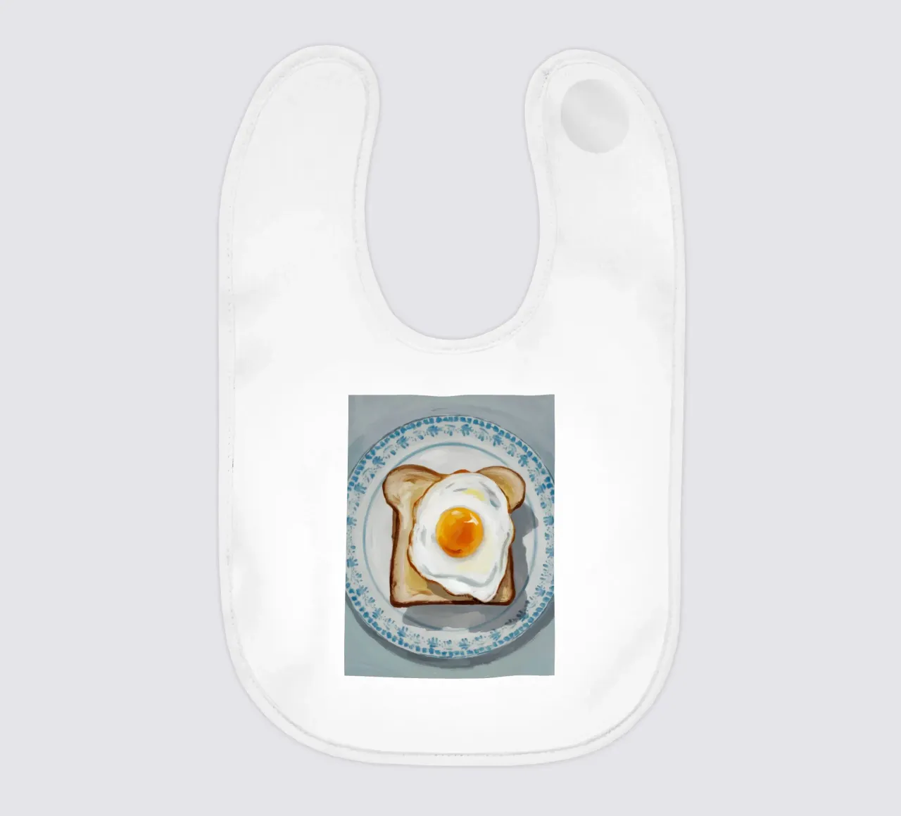 Piatto di uova su pane tostato bavaglino da Tiga Bersama
