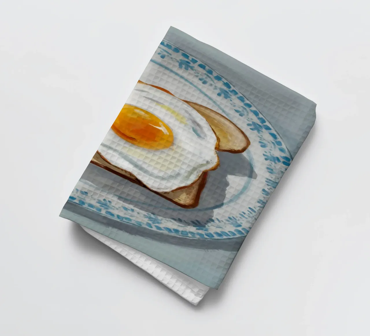Assiette d'œufs sur toast torchon de Tiga Bersama