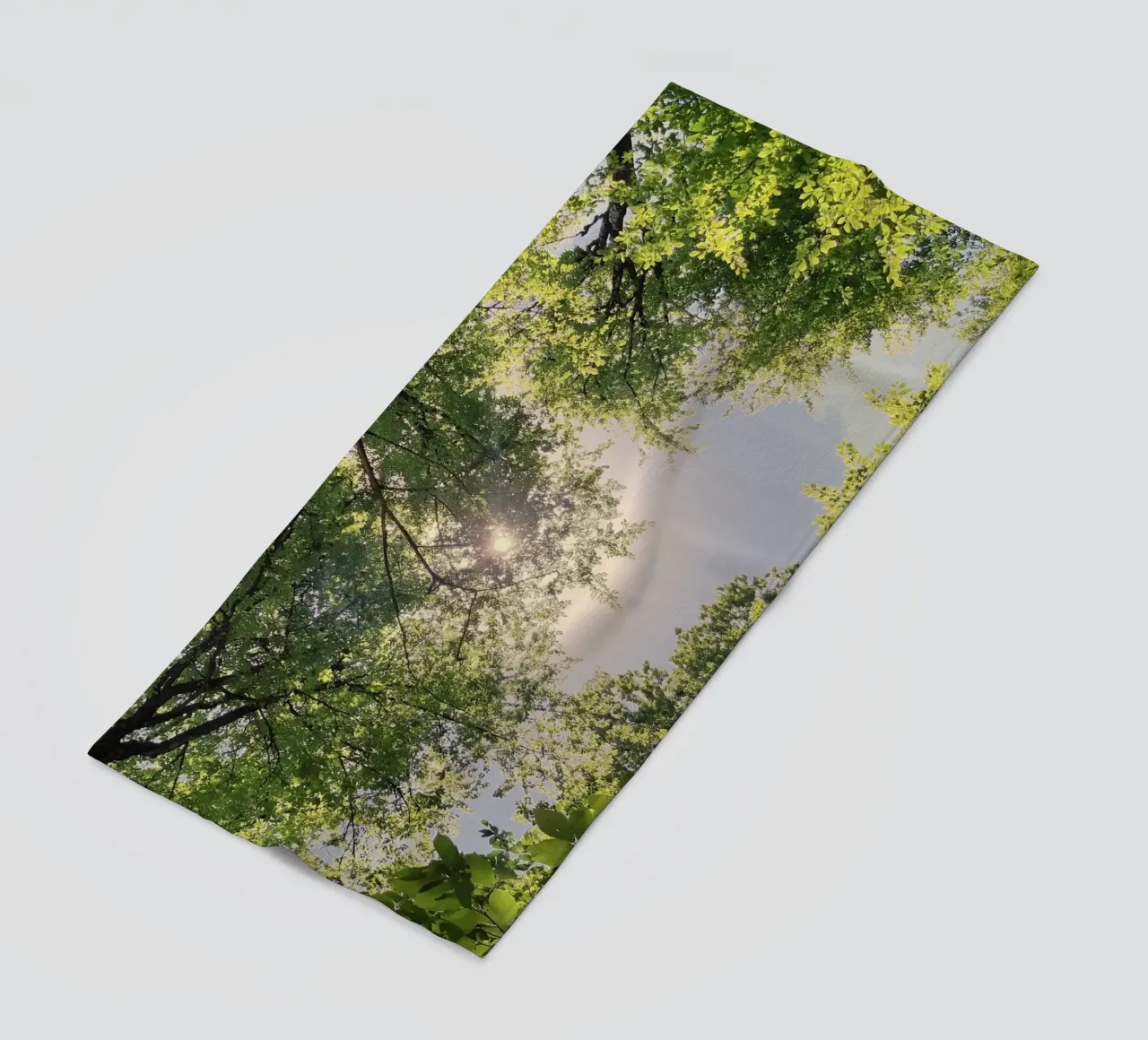 sunlight through trees beach towel by space words