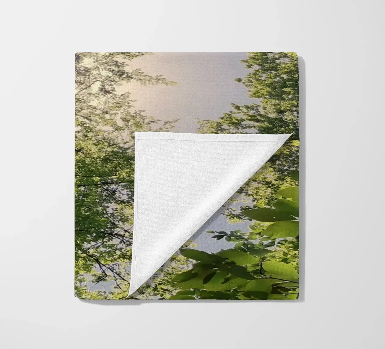 sunlight through trees beach towel by space words