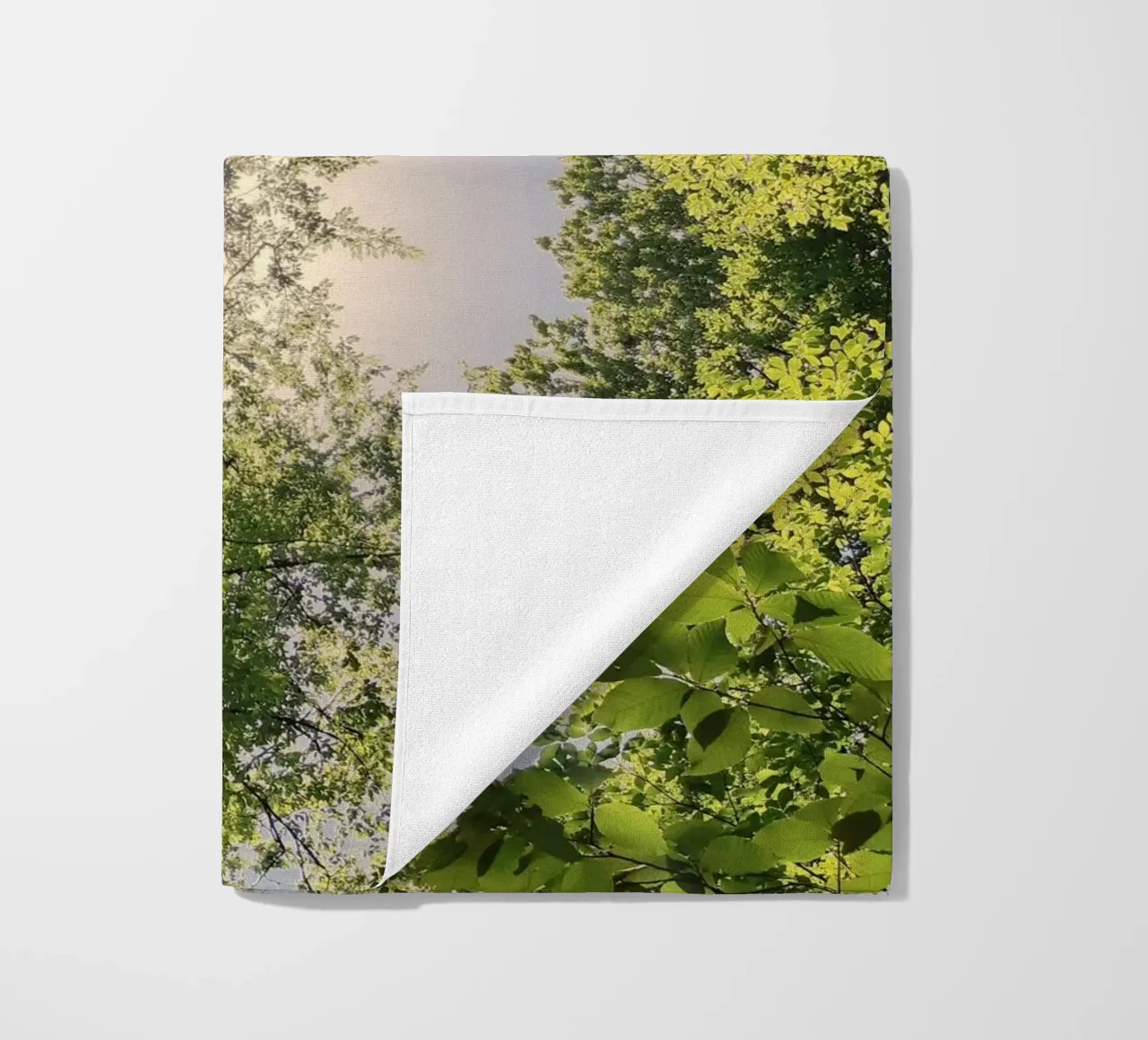 sunlight through trees beach towel by space words