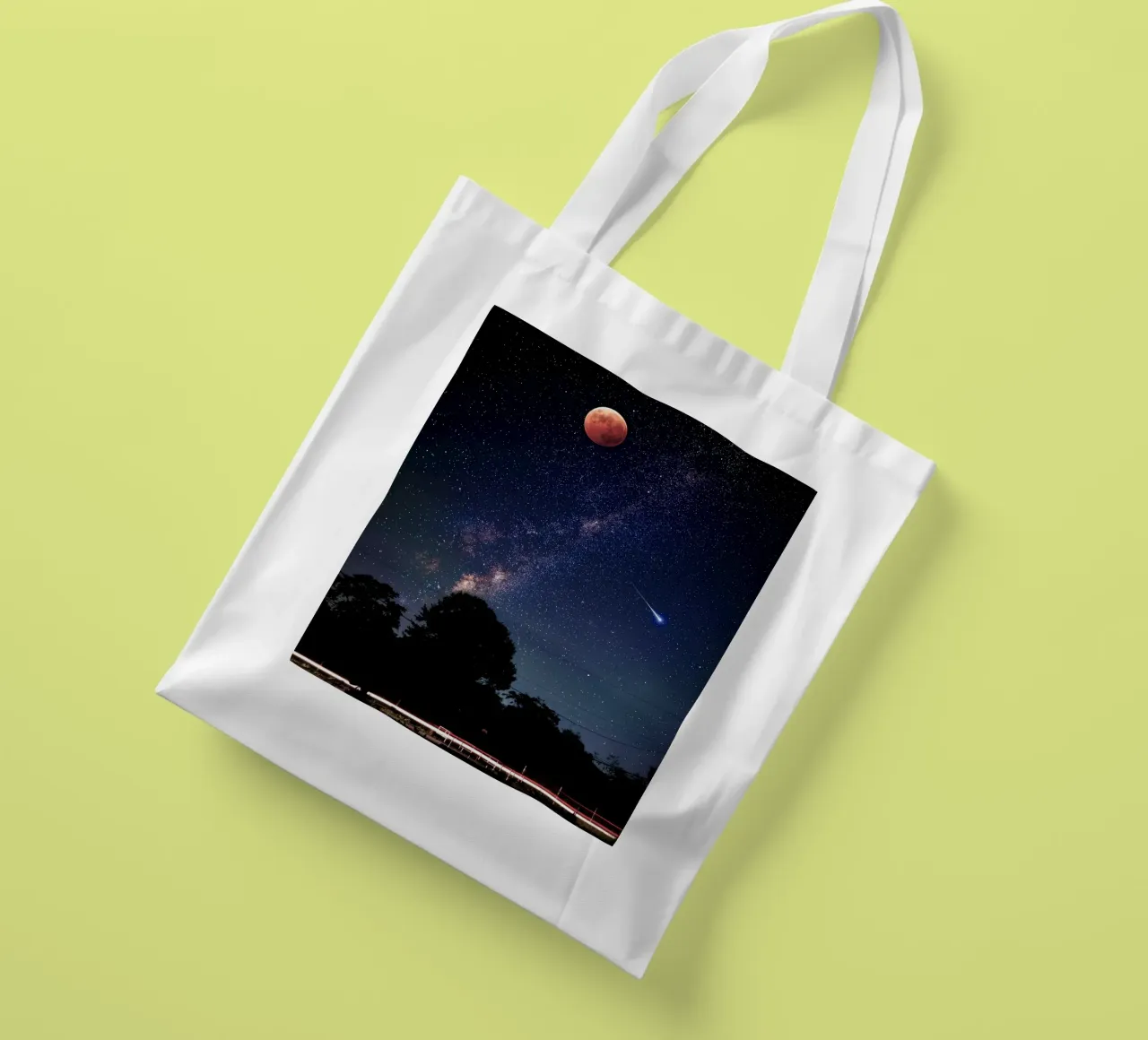 blood moon with shooting star tote bag by space words