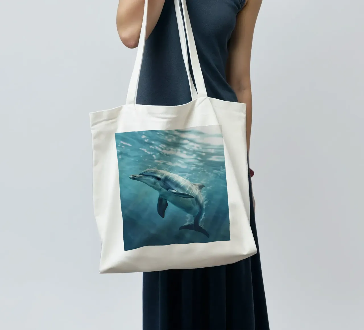 The Joyful Dolphin: Dancing Beneath the Waves tote bag by DesignDoodle