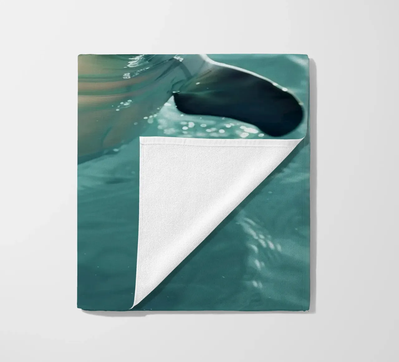 Waves of Joy: The Bottlenose Dolphin in Action beach towel by DesignDoodle