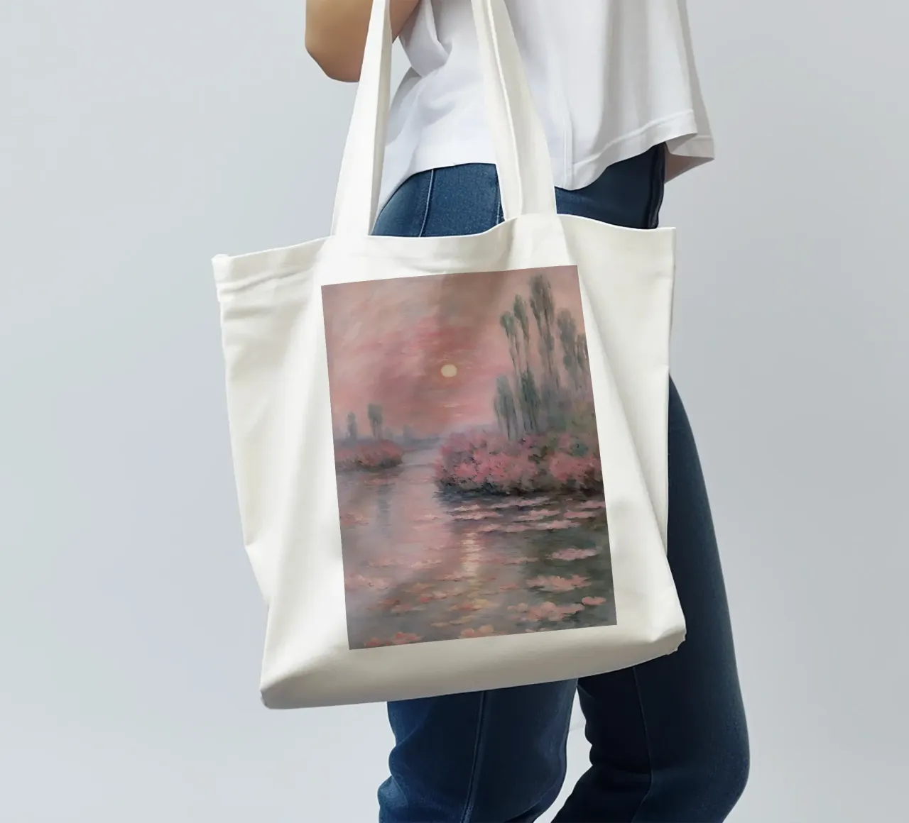 sunset over the water with trees and bushes surrounding it tote bag by SMG Store