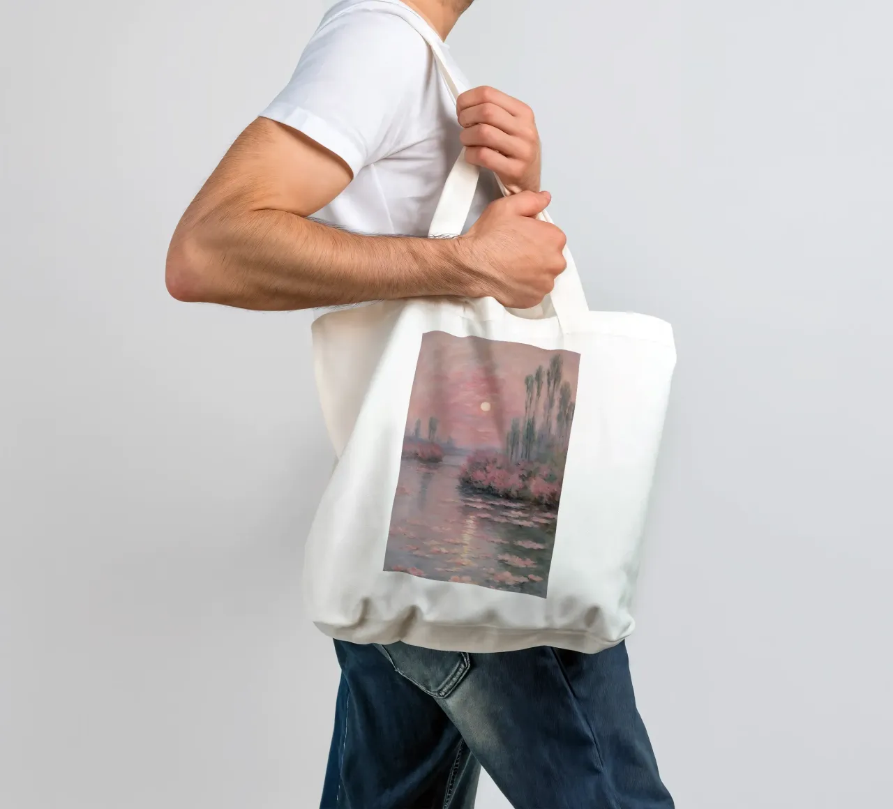 sunset over the water with trees and bushes surrounding it tote bag by SMG Store