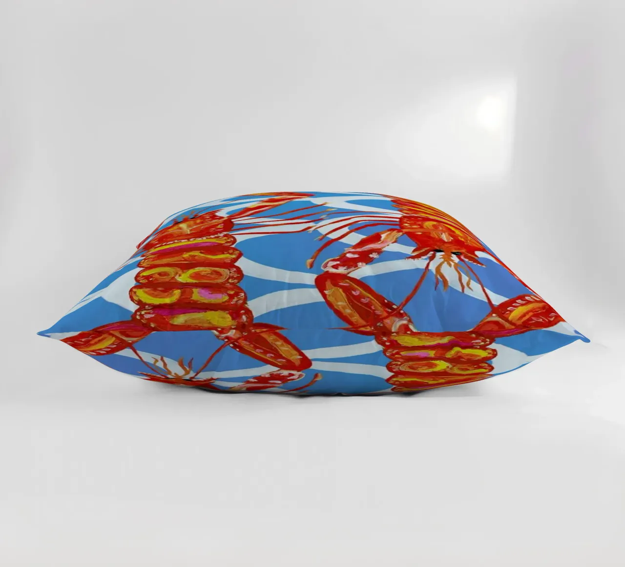 Langoustines On Blue Wavey decorative cushion by Alice Straker