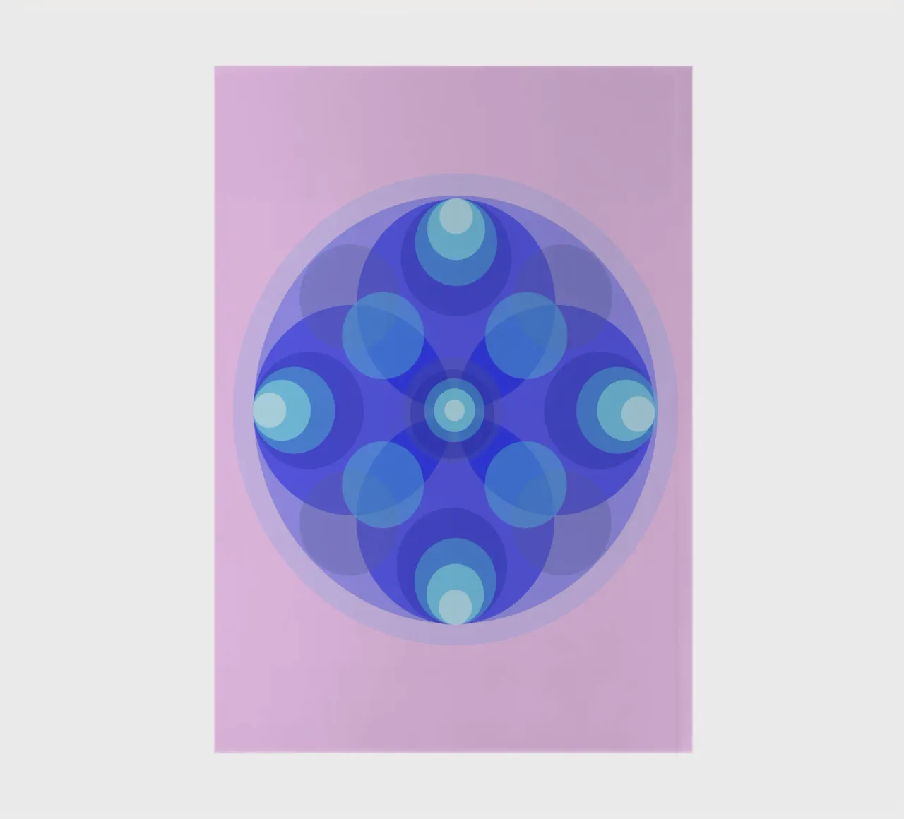 Blue abstract retro flower mandala in front of pink notebook by Lilou Art