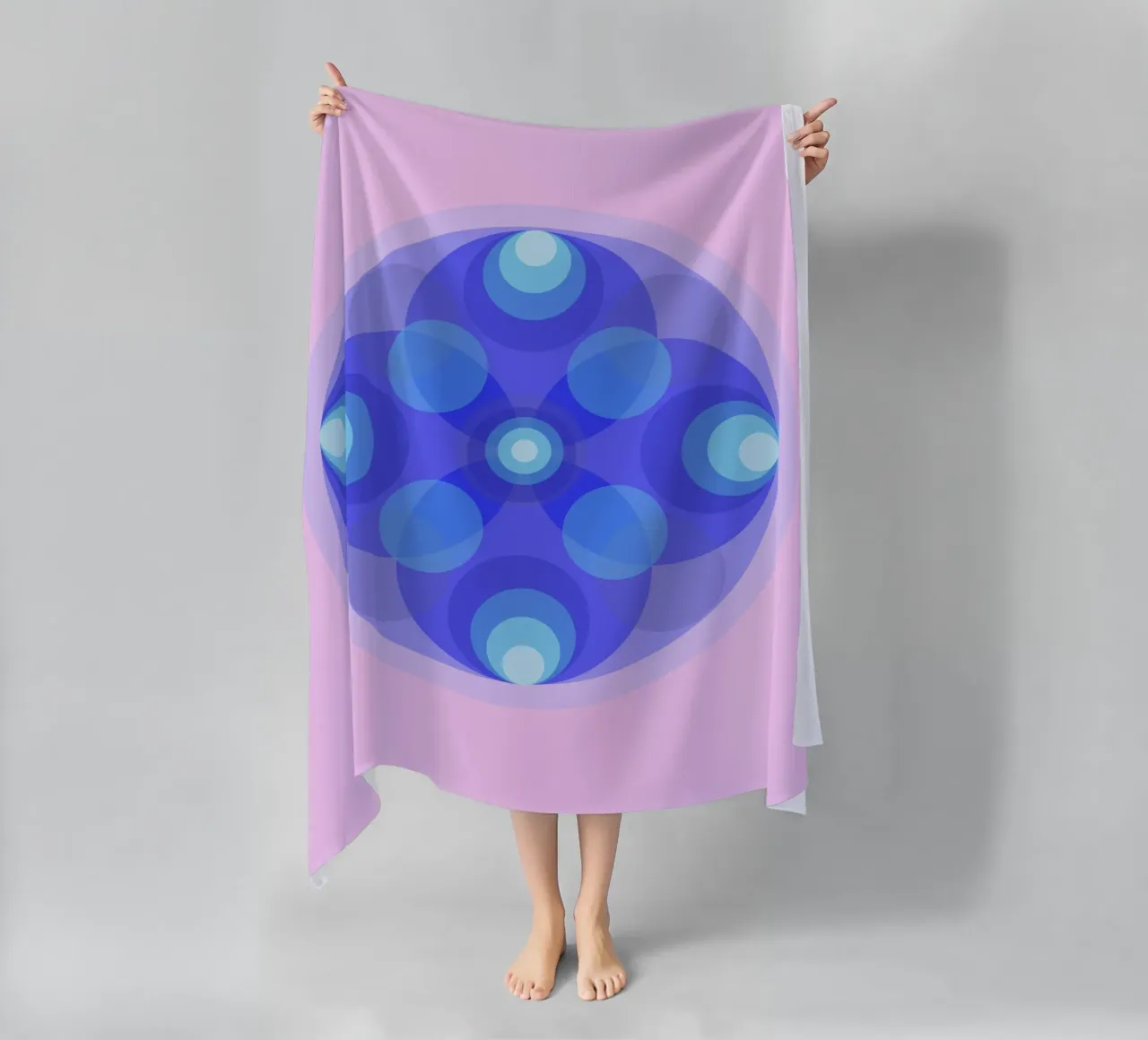 Blue abstract retro flower mandala in front of pink beach towel by Lilou Art