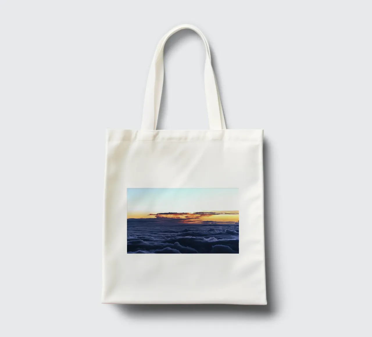 cloudscape and sun rays tote bag by space words