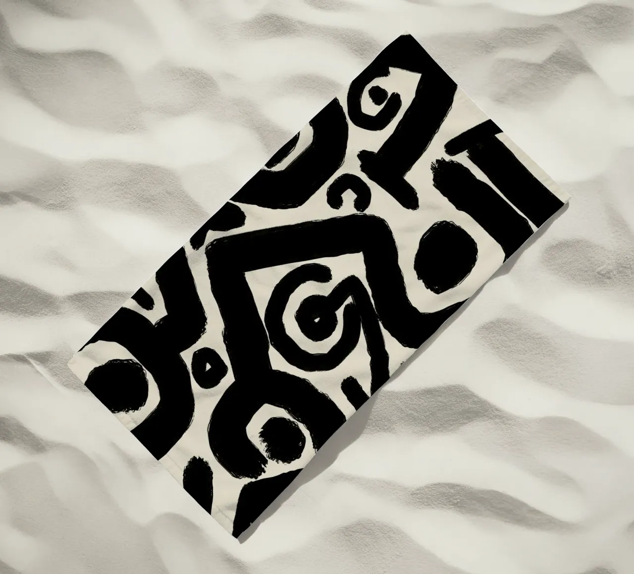Bold black abstract beach towel by Little Dean