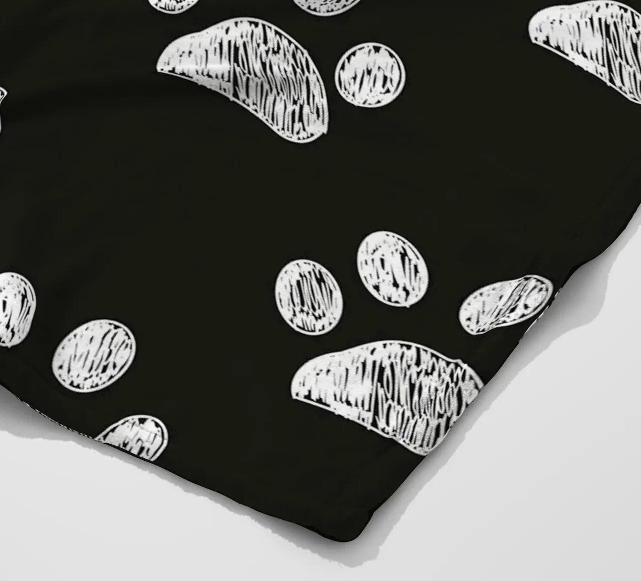 White paw prints black background pattern fleece blanket by gulsengunel