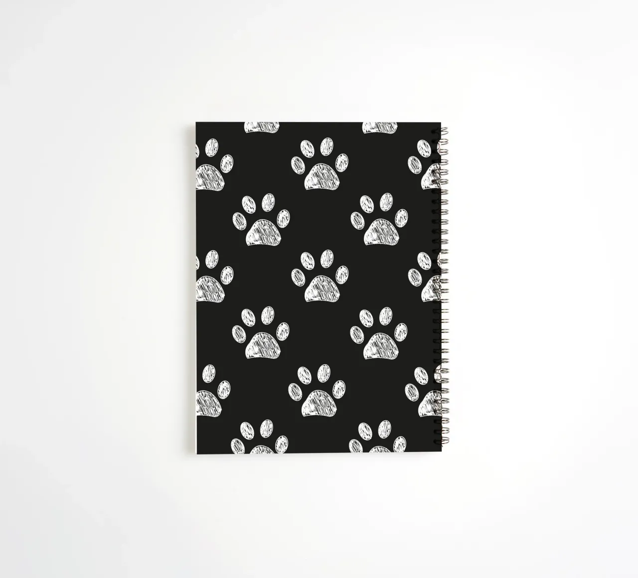 White paw prints black background pattern spiral notebook by gulsengunel