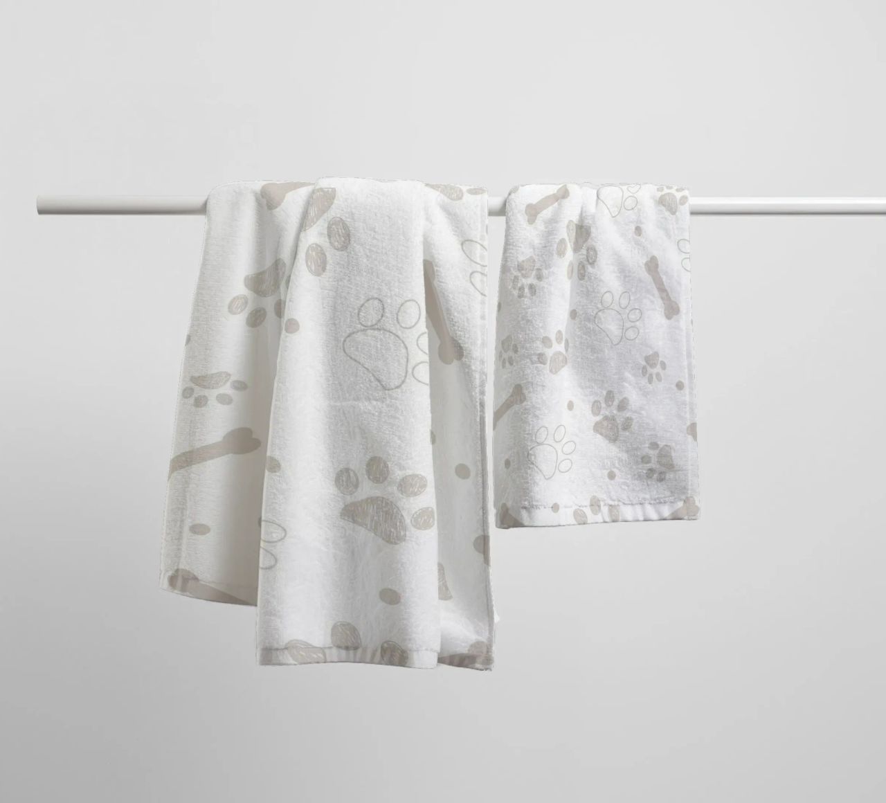 Grey paw and bones pattern towel by gulsengunel