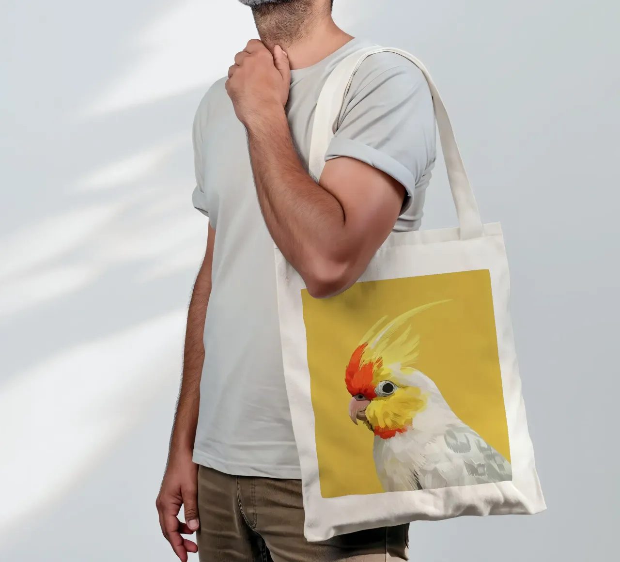 Lutino Cockatiel against a solid yellow background tote bag by DesignDoodle