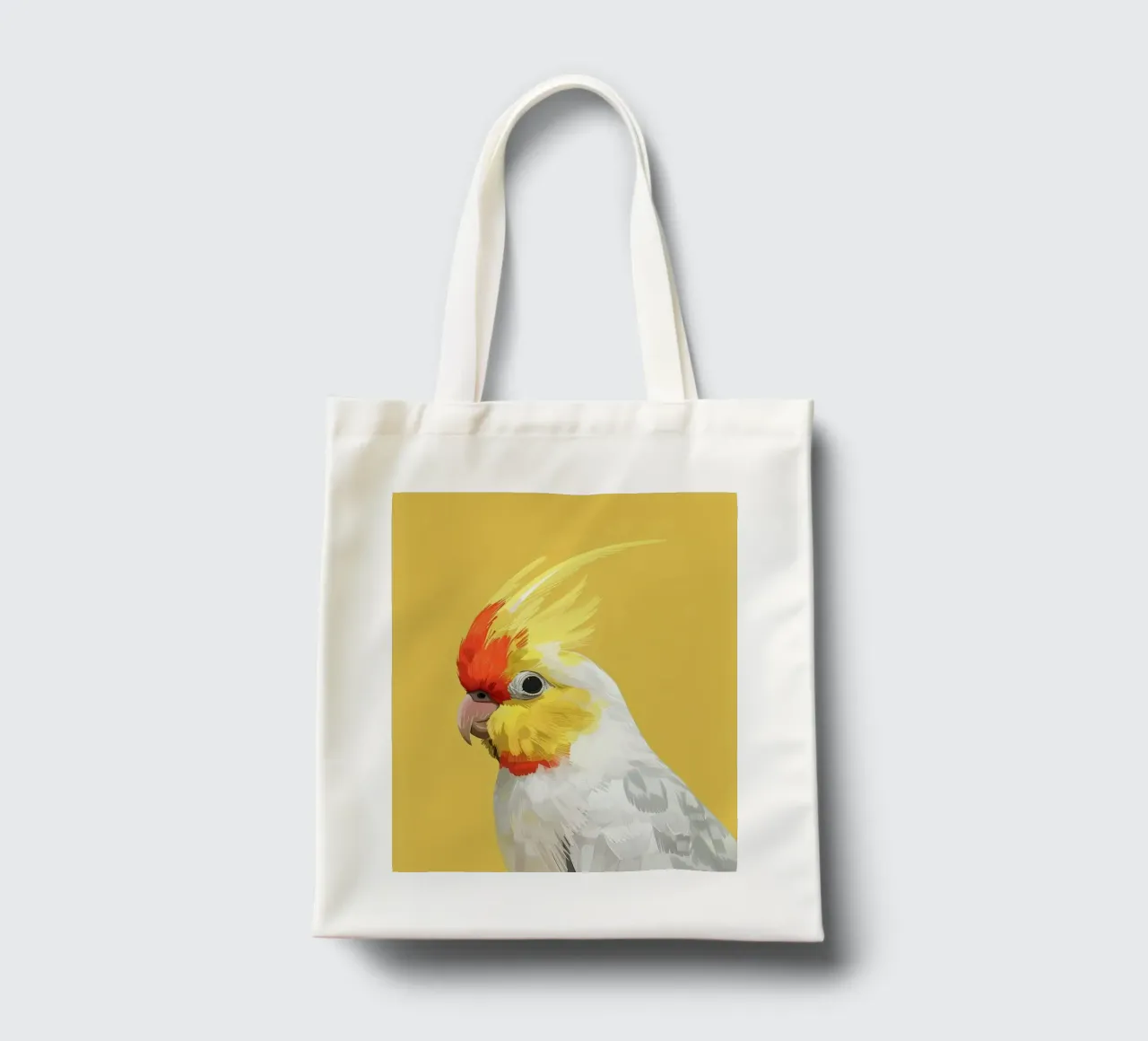 Lutino Cockatiel against a solid yellow background tote bag by DesignDoodle